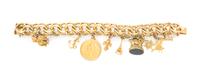 A 14 Karat Yellow Gold Charm Bracelet with Ten Charms, 96.90 dwts.