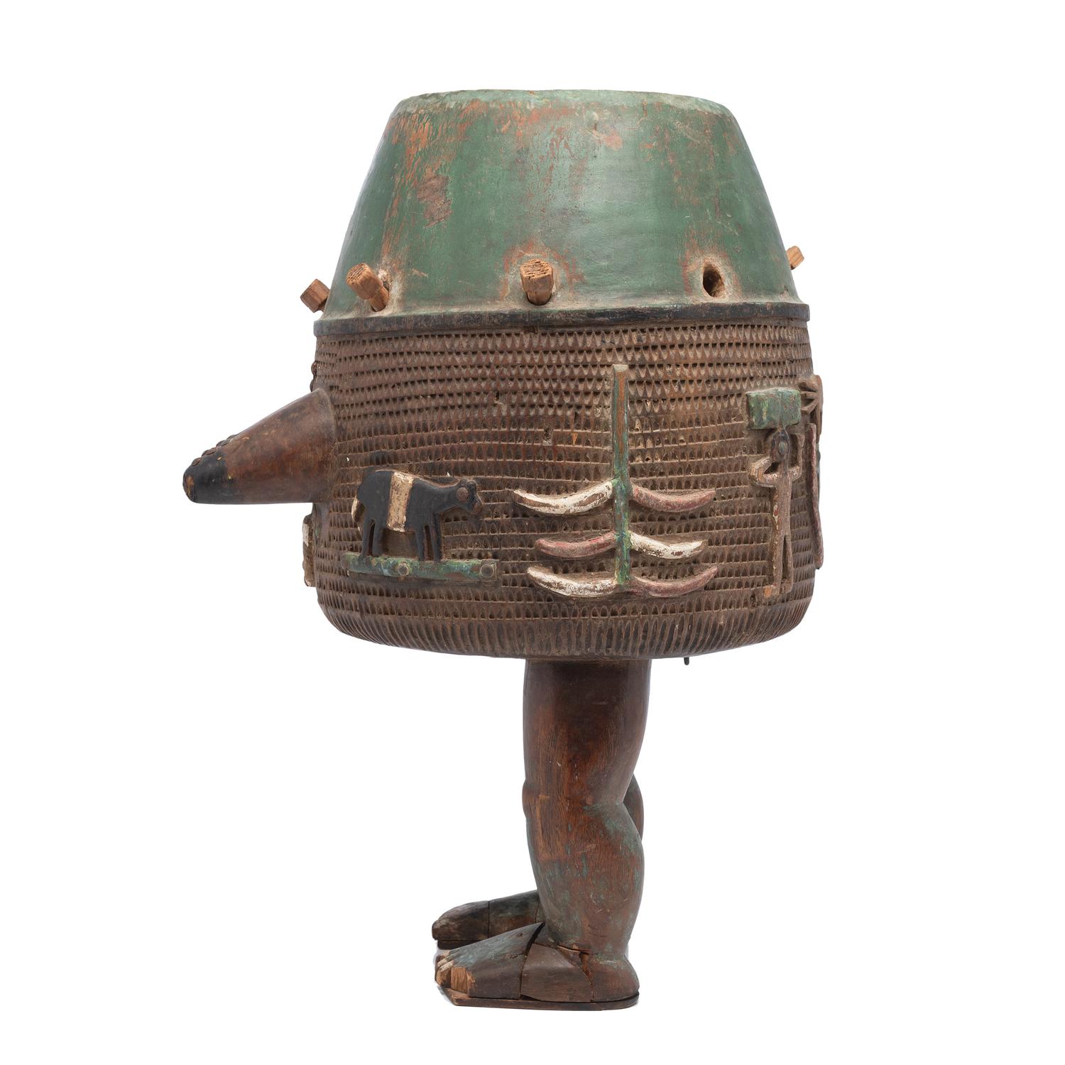 An Ashanti Carved and Gouged Painted Wood Breasted Drum