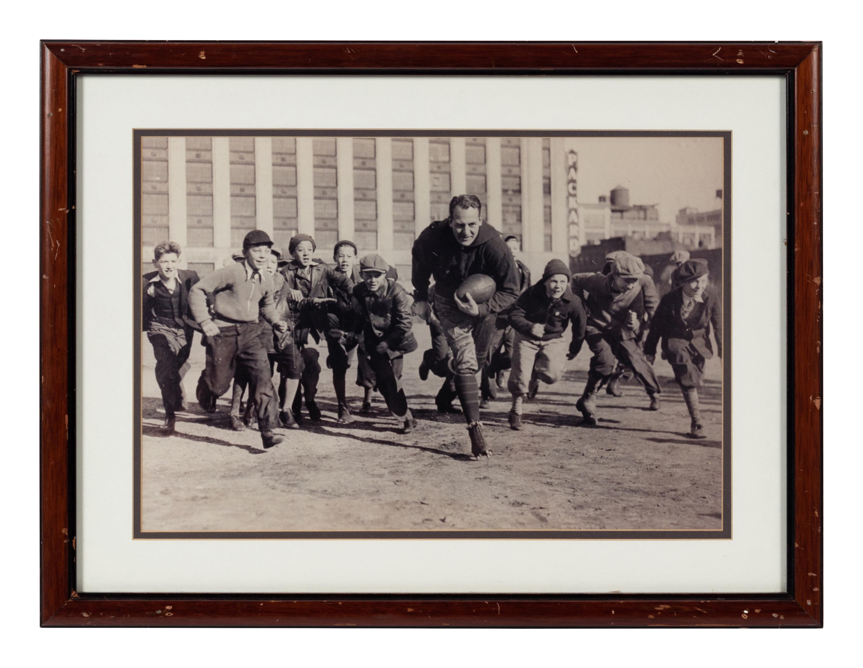 A Group of Six Early Twentieth Century Football Photographs Formerly Displayed at Mike Ditka's Restaurant