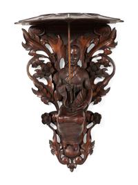 A Pair of Carved Oak Figural Wall Brackets