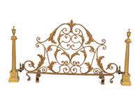 A Pair of Continental Gilt Bronze Chenets and an Associated Fire Screen