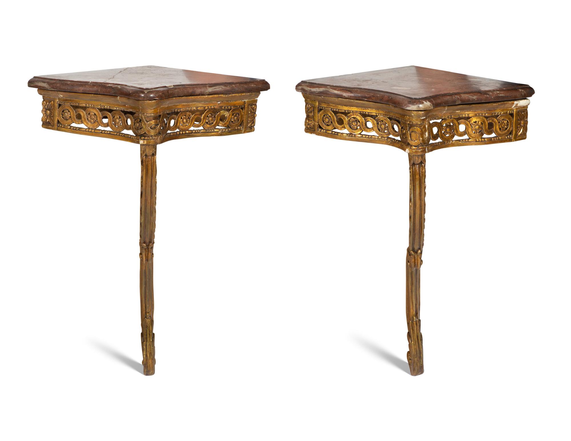 A Pair of Louis XVI Giltwood Corner Tables
