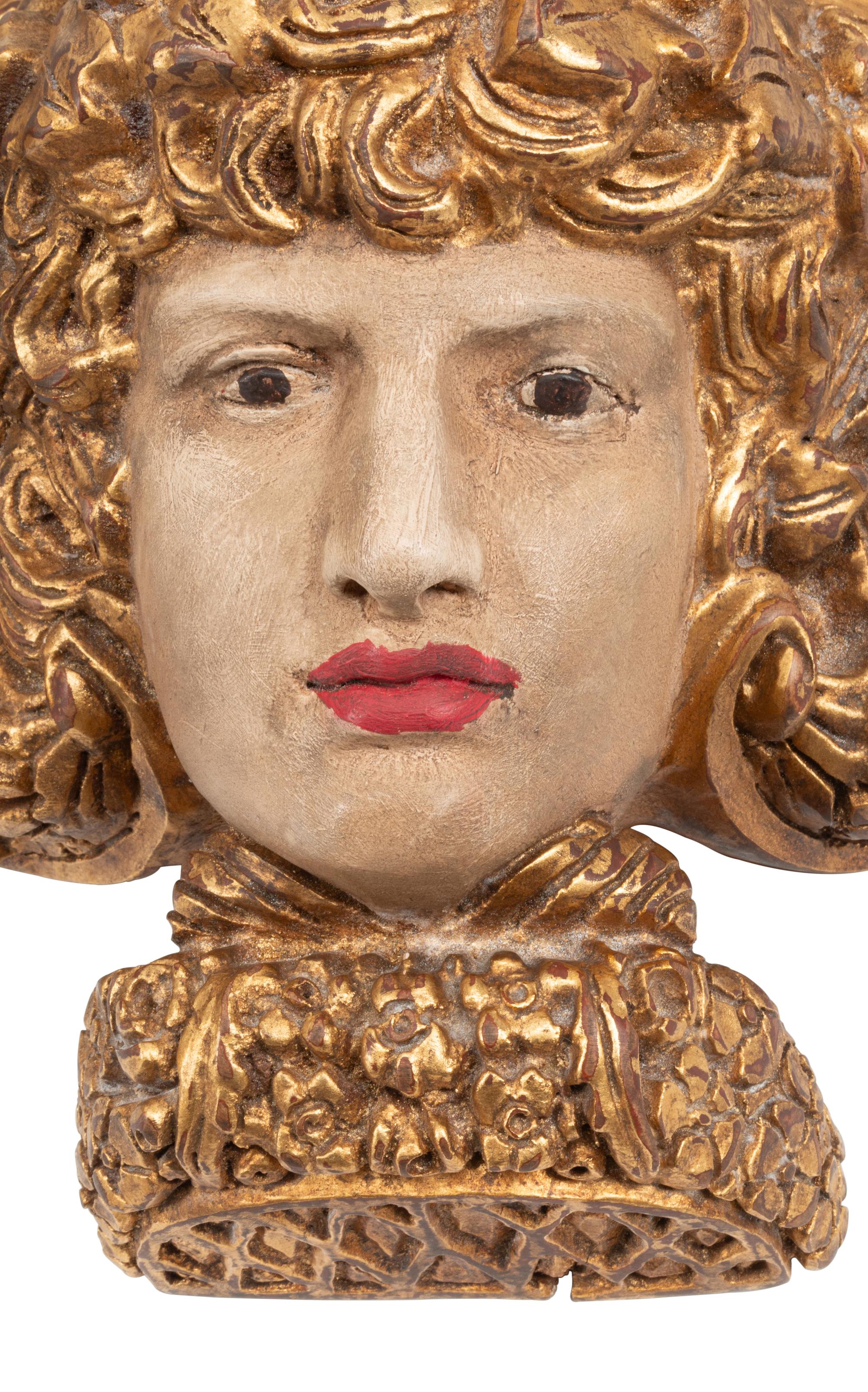 A Set of Four Italian Carved, Painted and Parcel Gilt Wall Brackets