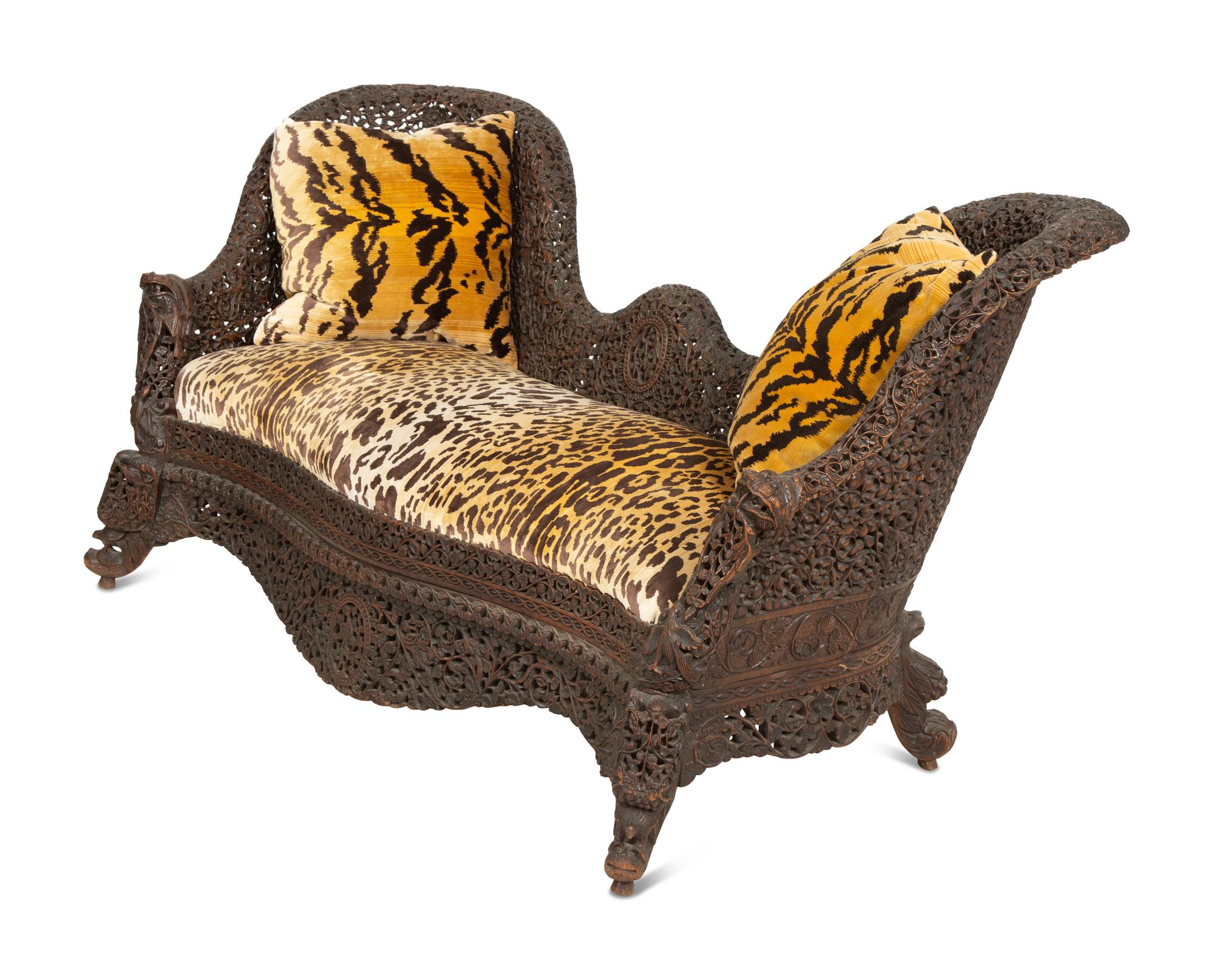 Two Similar Anglo-Burmese Carved Teak Settees