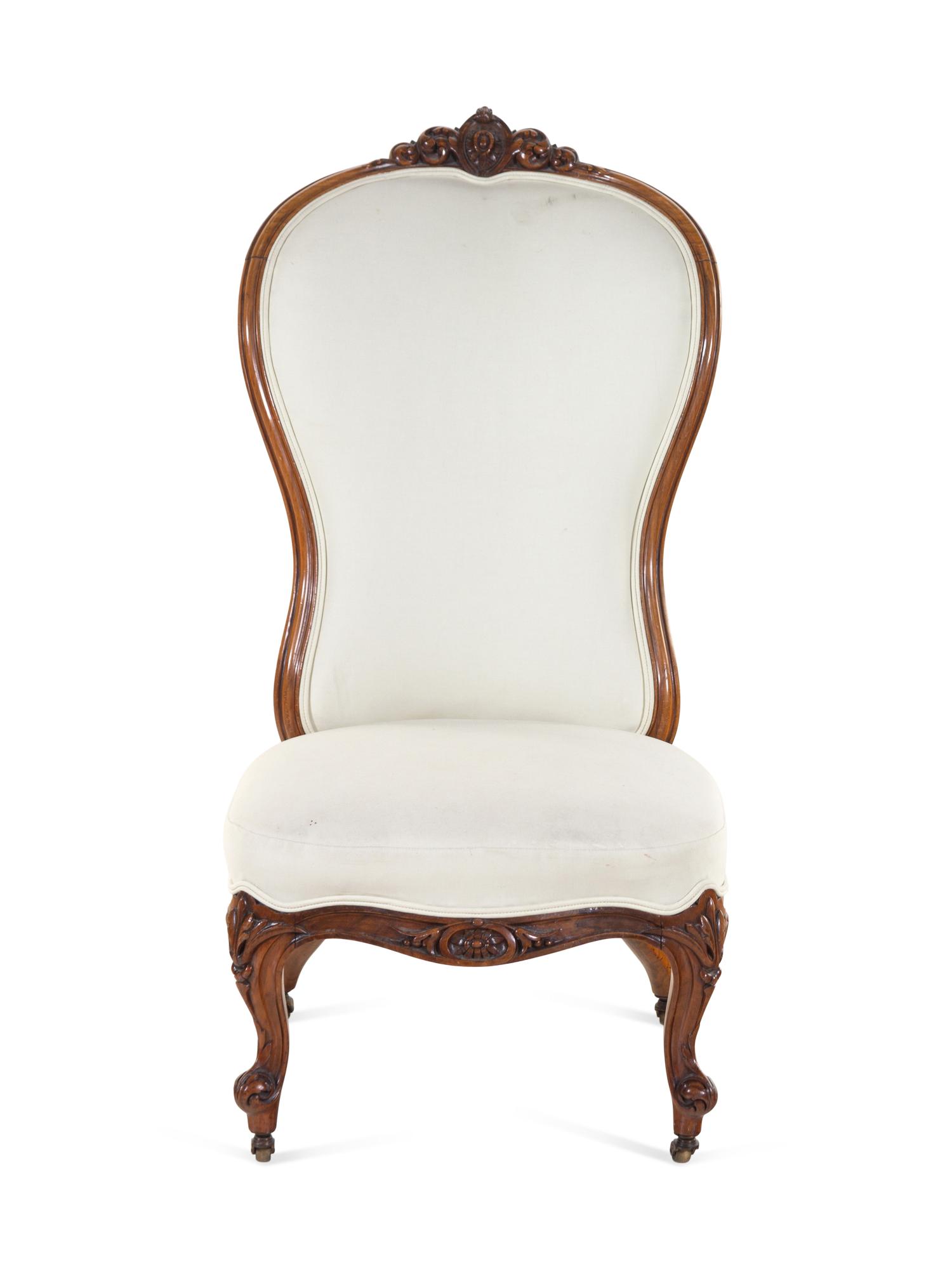 A Baroque Revival Mahogany Balloon Back Slipper Chair