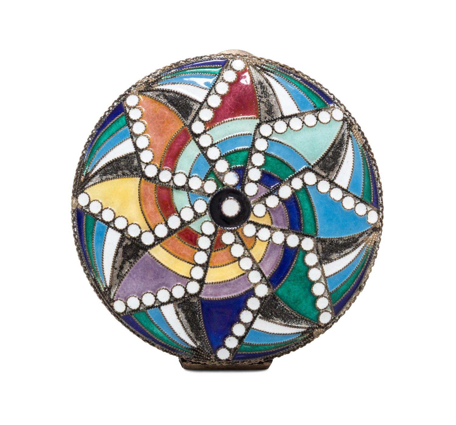A Soviet Art Deco Enameled Slver Compact, St. Petersburg, 20th Century, of circular form with polychrome geometric decoration.