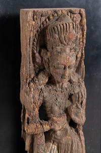 An Indian Carved Wood Figure of a Deity