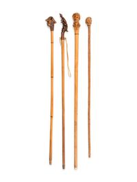Four Figural Carved Wood Walking Sticks
