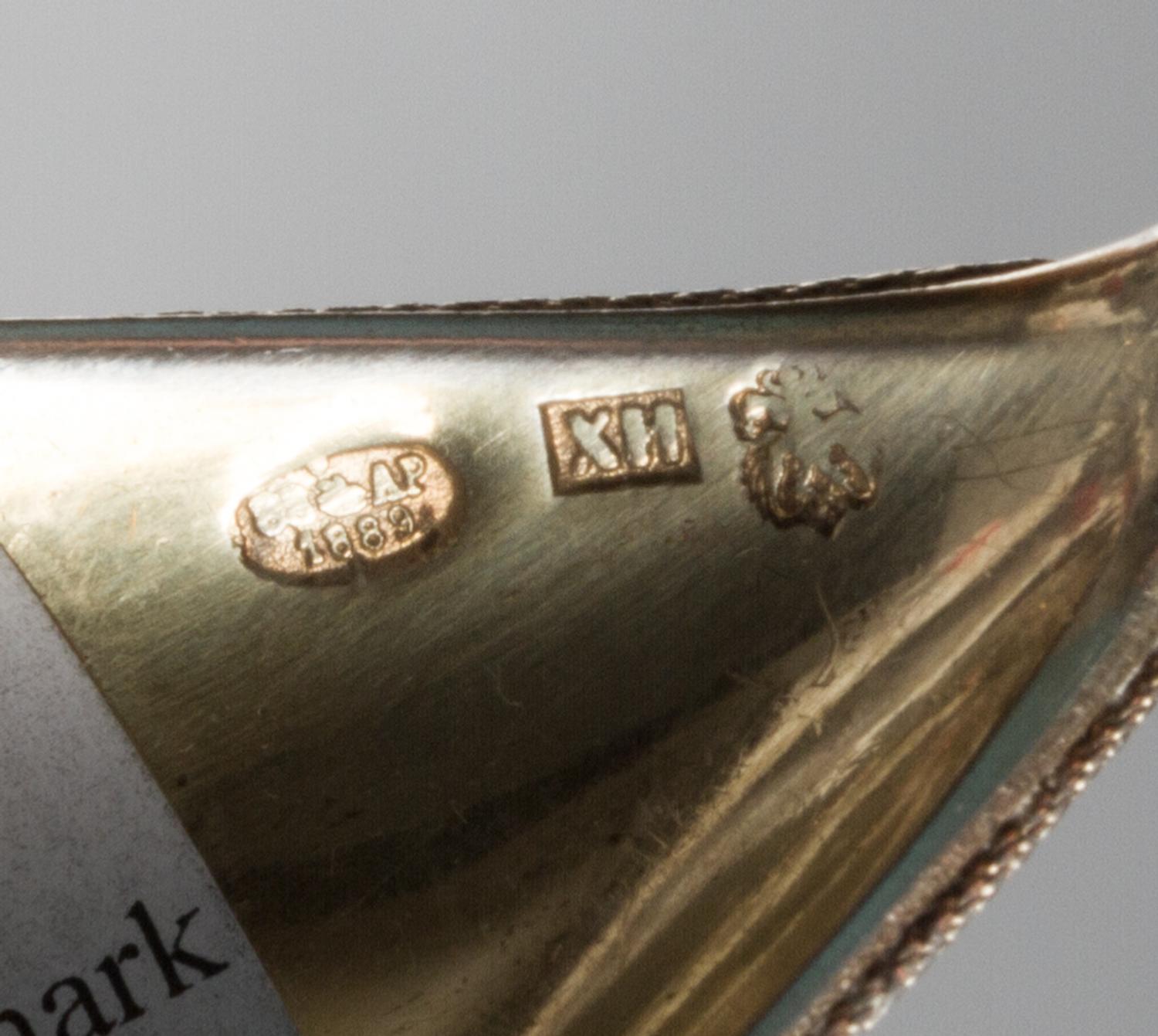 A Russian Silver-Gilt and Enamel Spoon, Mark of Ivan Khlebnikov with Imperial warrant, assay mark of A. Romanov, Moscow, 1889, the hand