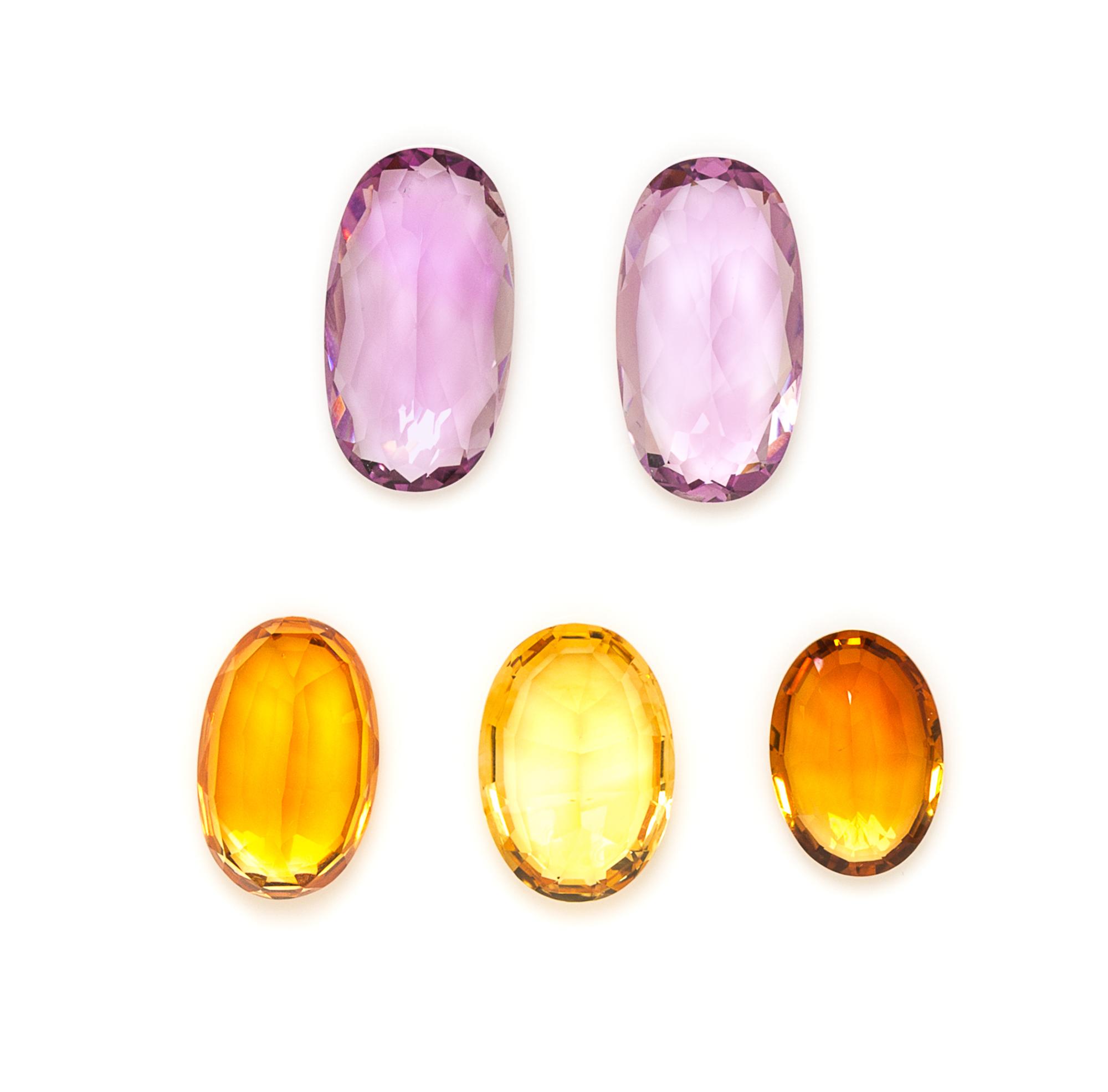A Collection of Oval Mixed Cut Citrine and Amethysts,