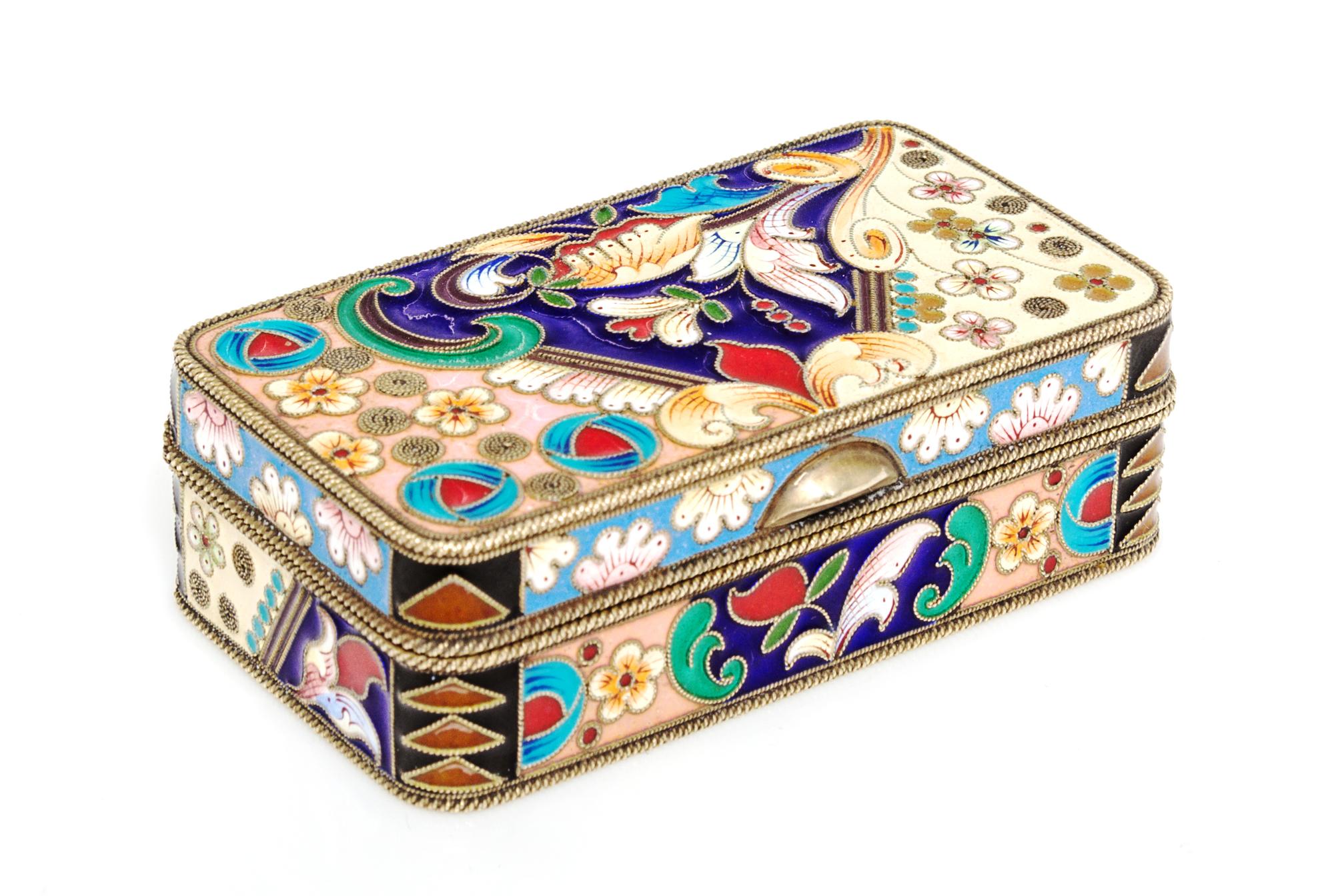A Russian Enameled Silver-Gilt Box, 1908-1926, of rectangular form with polychrome floral decoration.