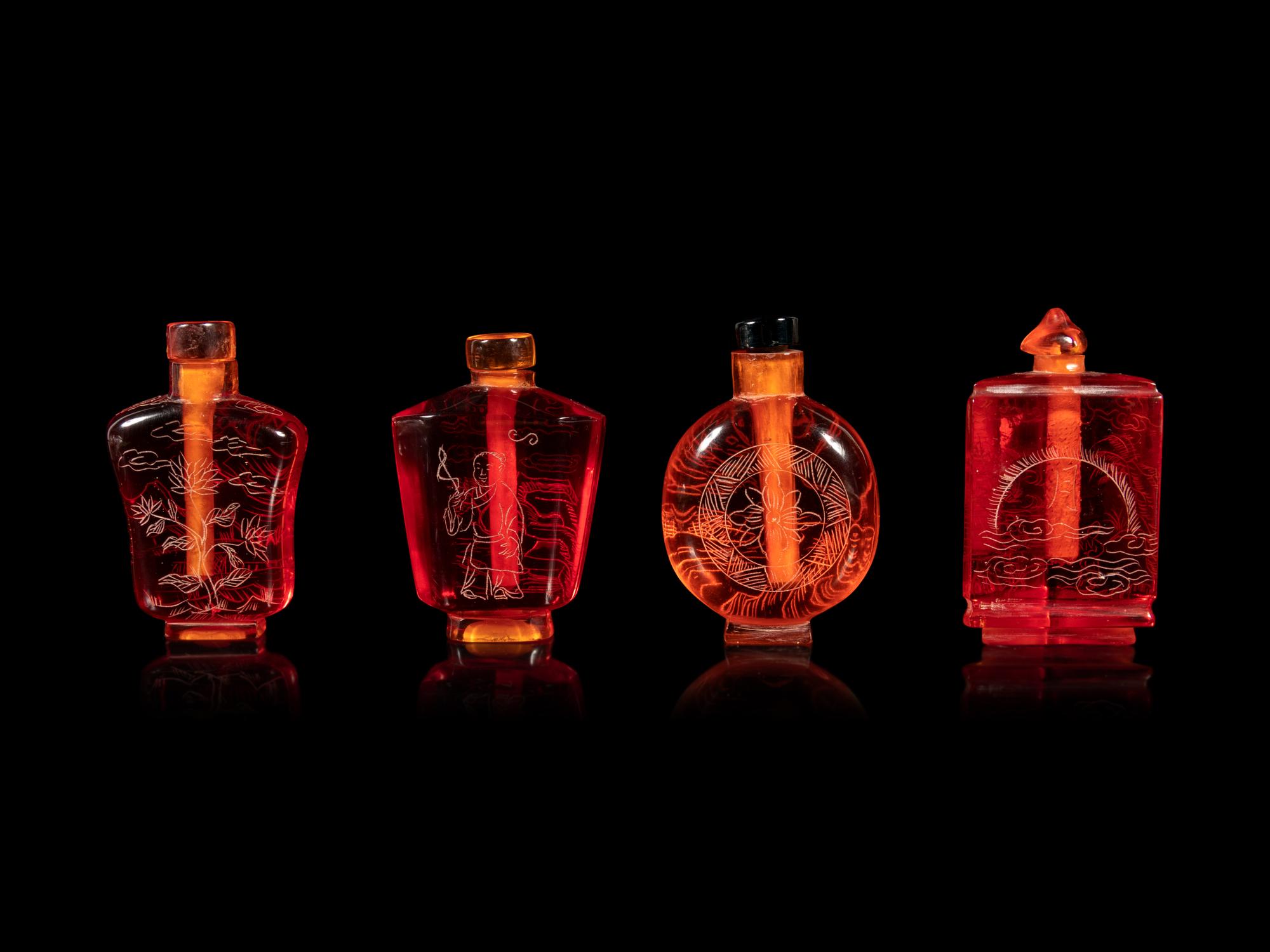 Four Chinese Amber Tone Glass Snuff Bottles