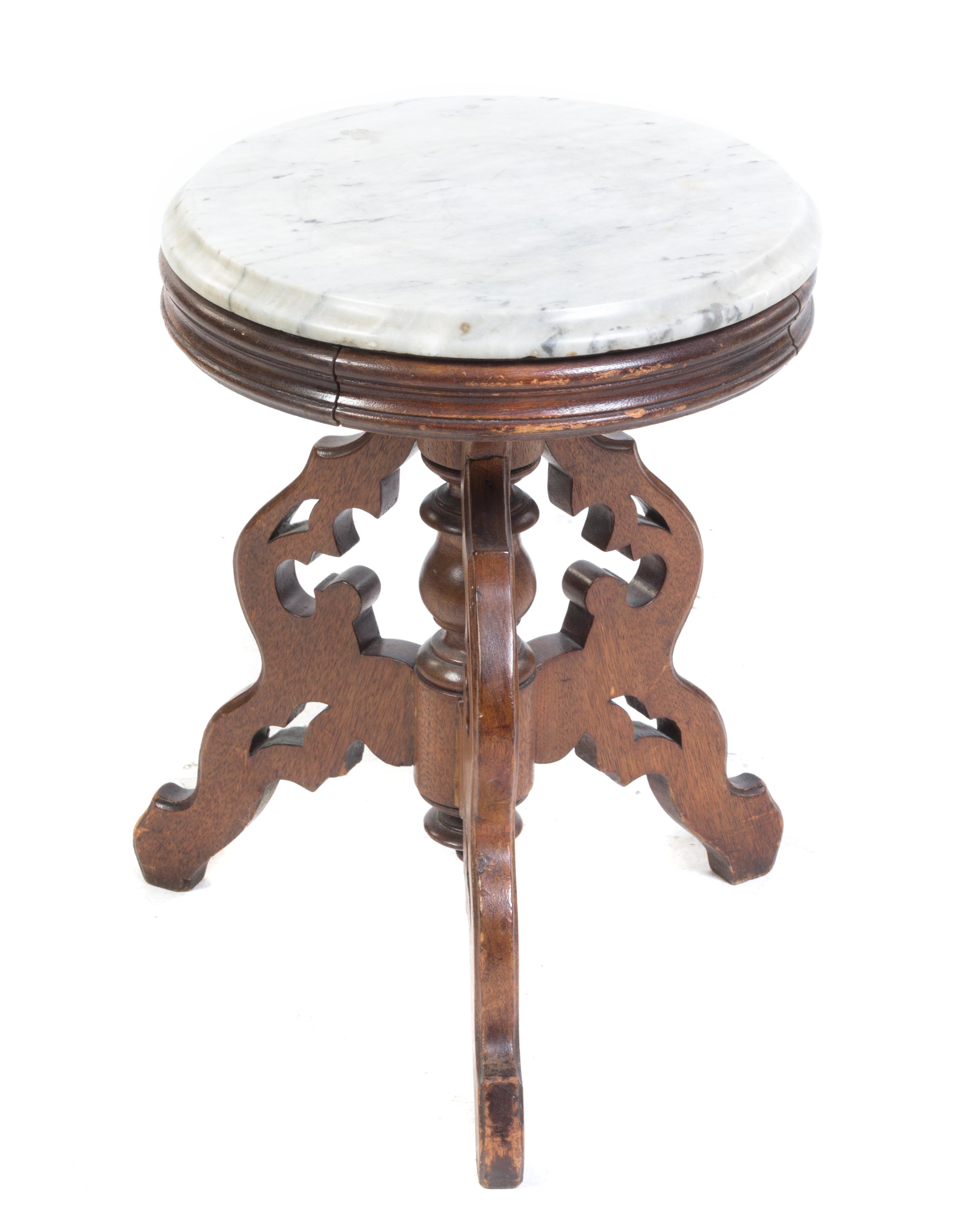 A Victorian Walnut Occasional Table Height 19 x diameter 14 1/2 inches. — 19TH CENTURY