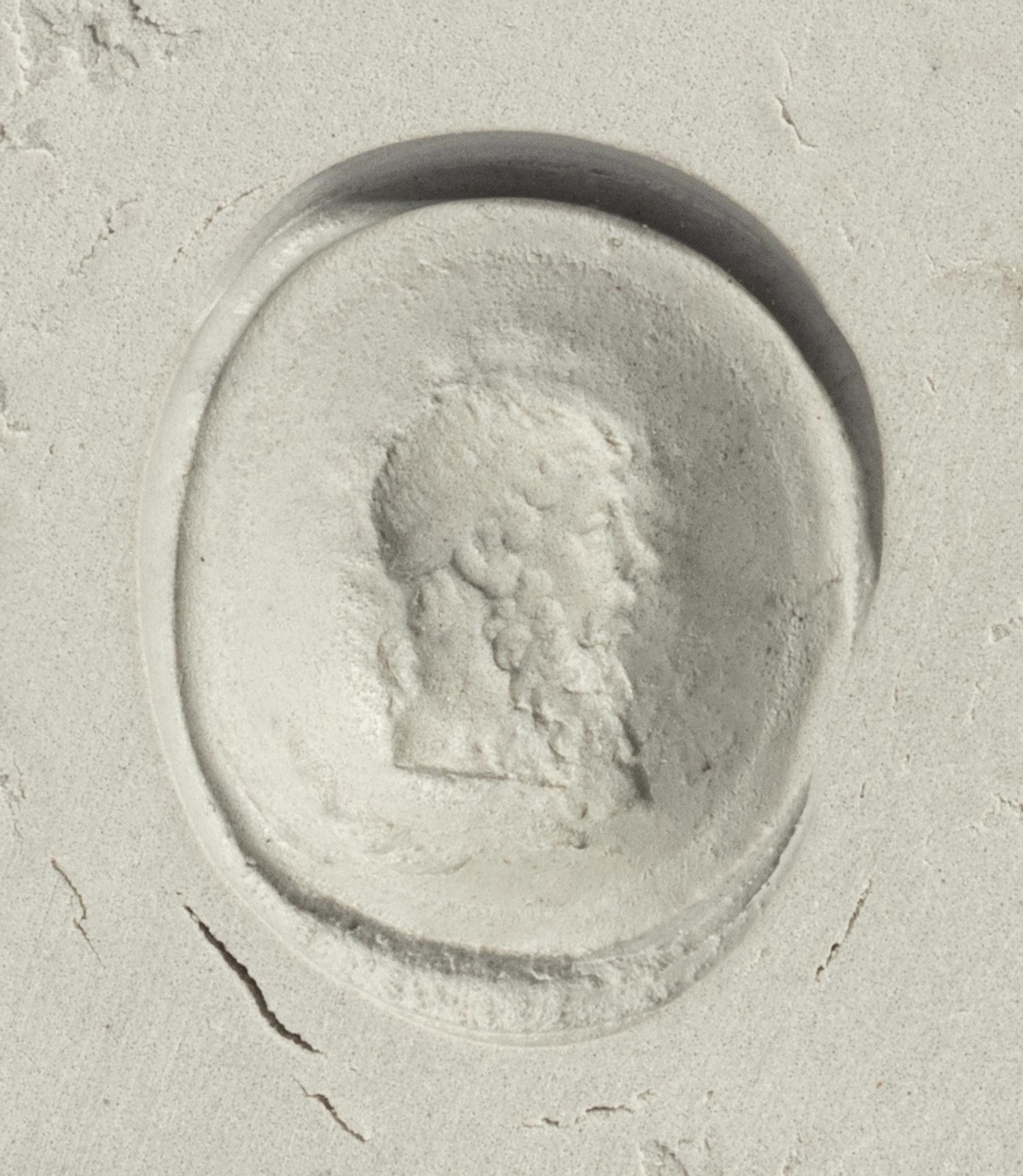 A Roman Banded Agate Ring Stone with the God Dionysus — Set in a gold ring