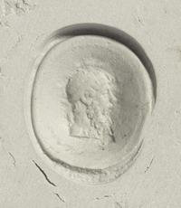 A Roman Banded Agate Ring Stone with the God Dionysus — Set in a gold ring