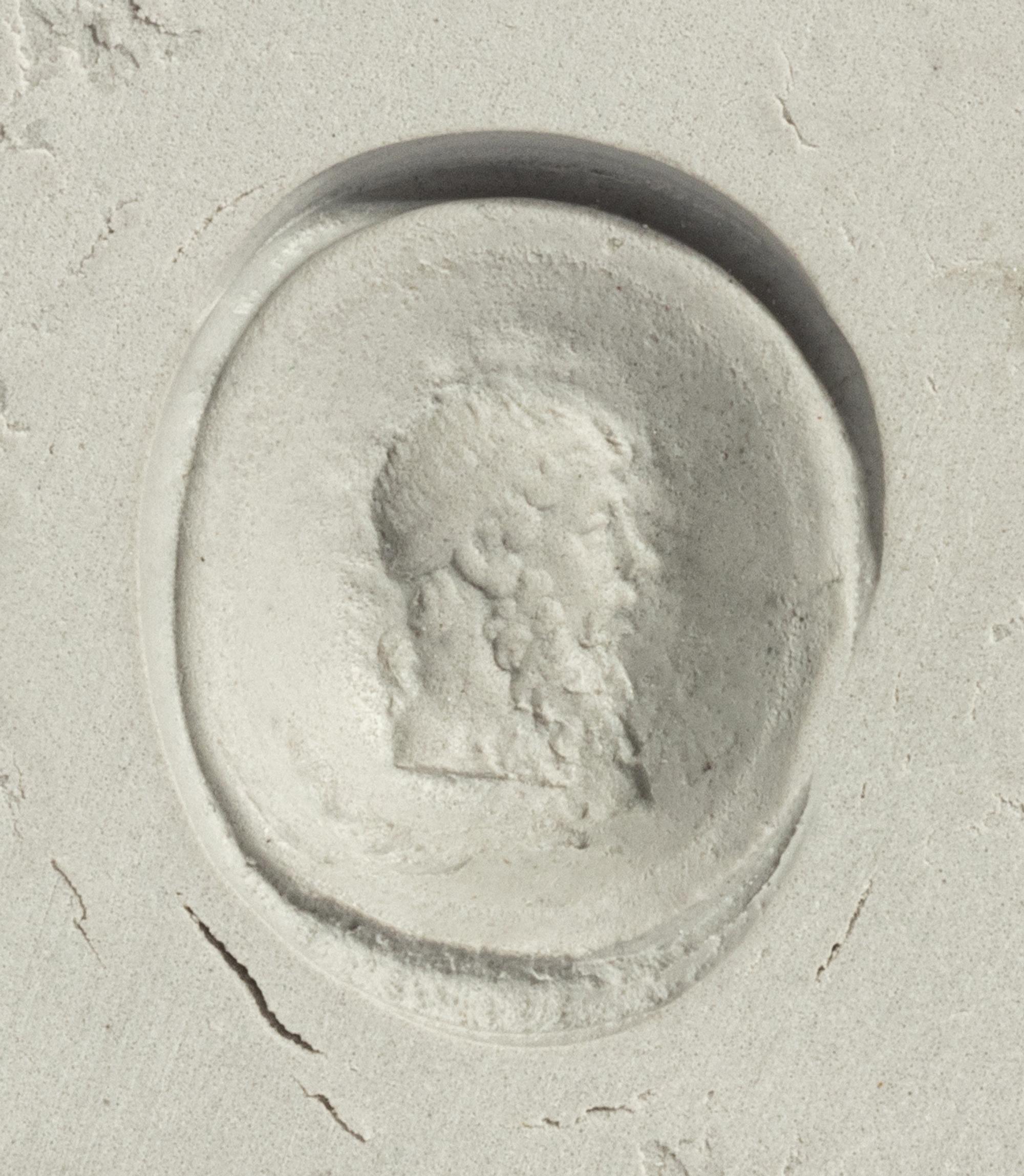 A Roman Banded Agate Ring Stone with the God Dionysus — Set in a gold ring
