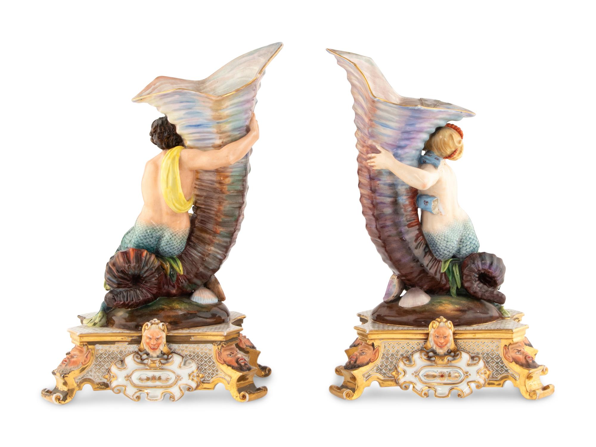 A Pair of Continental Porcelain Figural Vases