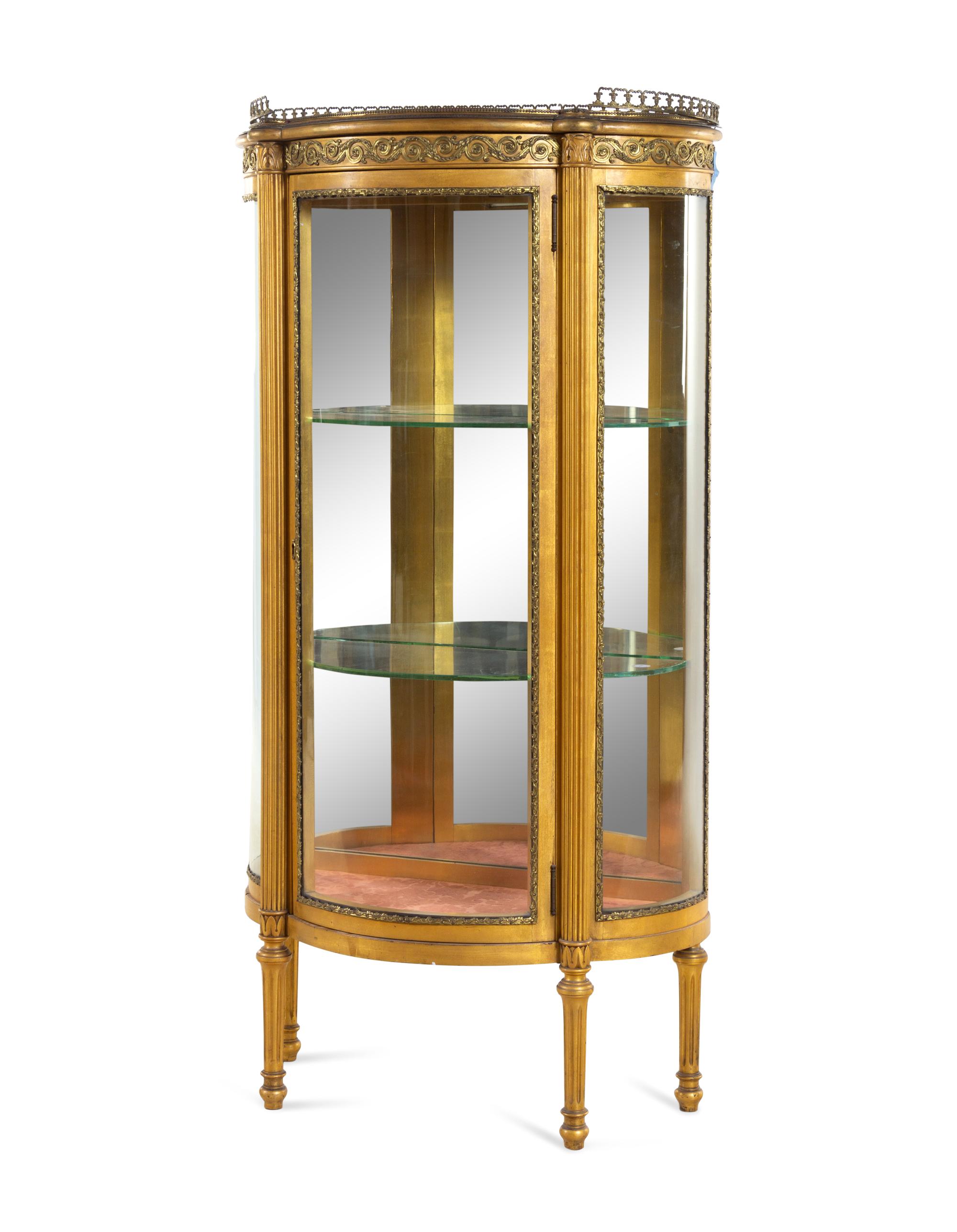 A Louis XVI Style Gilt Metal Mounted Giltwood Vitrine