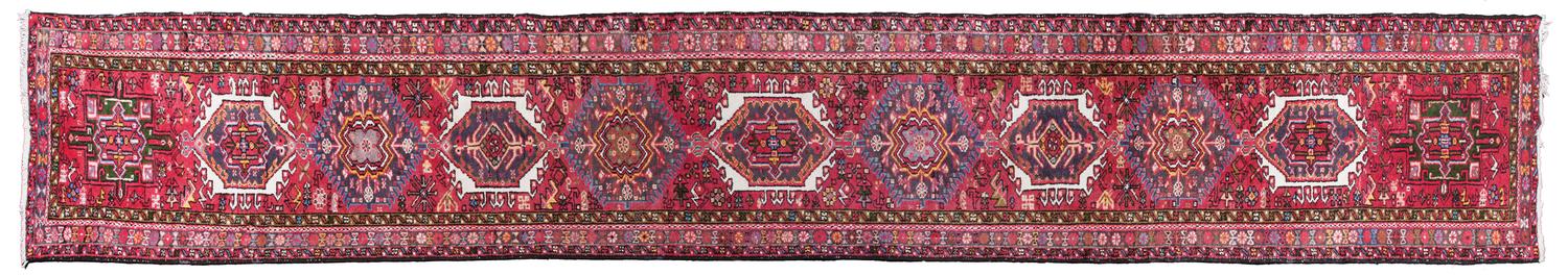 A Persian Wool Runner 2 feet 9 inches x 16 feet 3 inches.