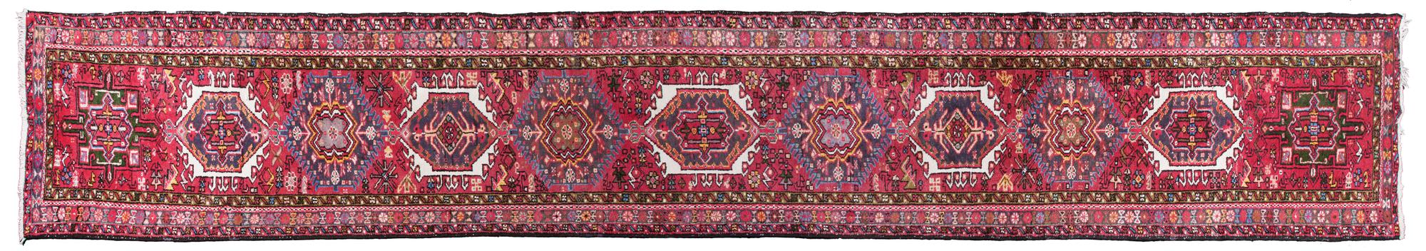 A Persian Wool Runner 2 feet 9 inches x 16 feet 3 inches.