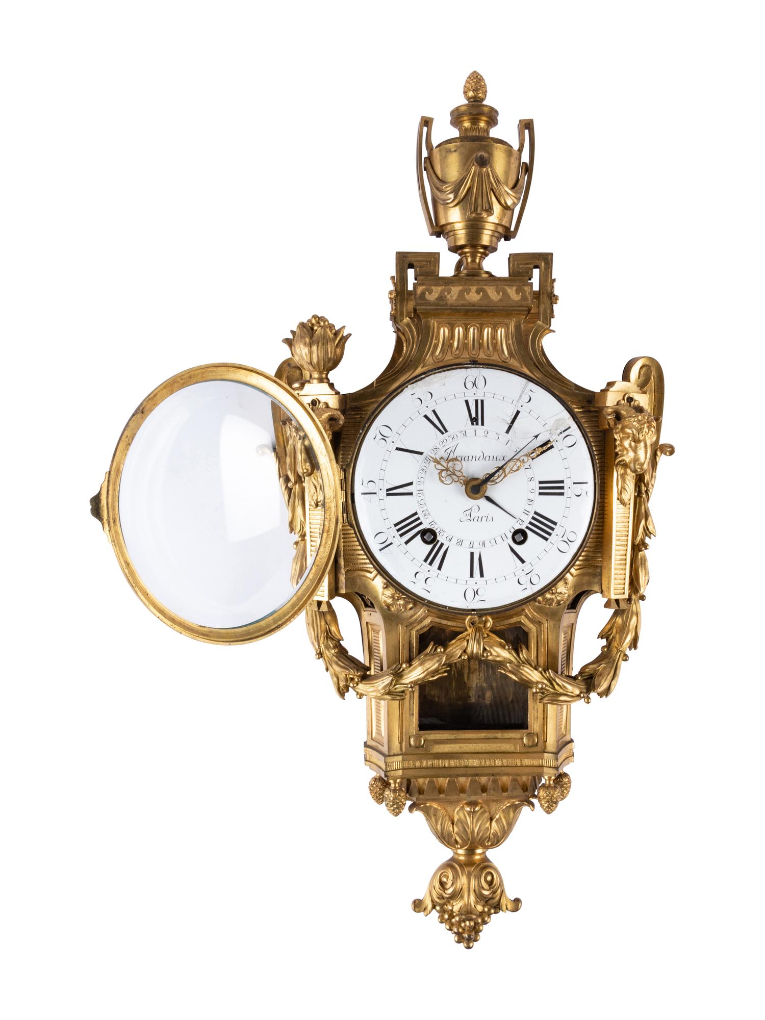 A Louis XVI Gilt Bronze Cartel Clock
