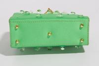 A Gianni Versace Green Silk Wristlet, 5.75" x 4" x 2"; Bracelet: 10" x .75".