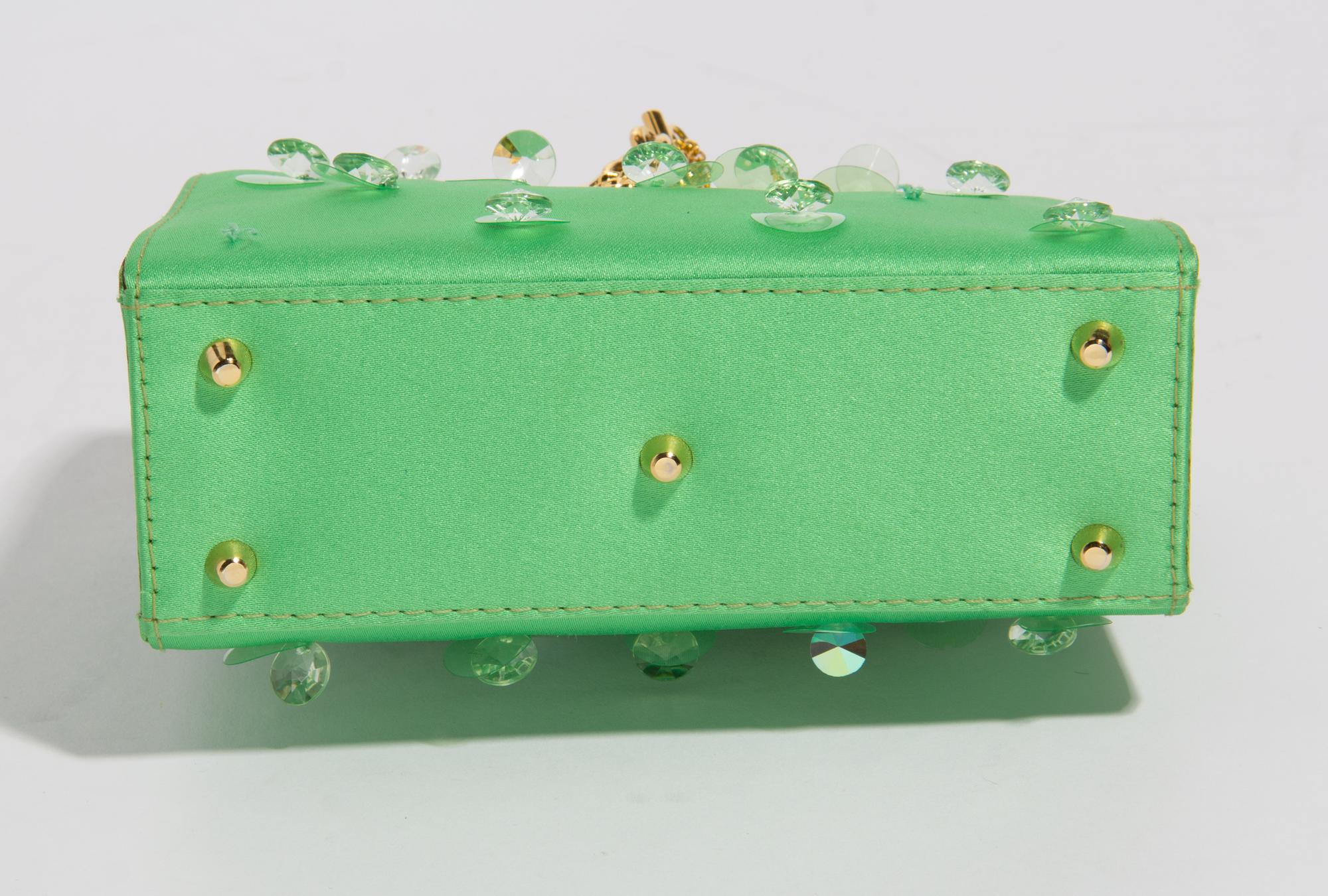 A Gianni Versace Green Silk Wristlet, 5.75" x 4" x 2"; Bracelet: 10" x .75".