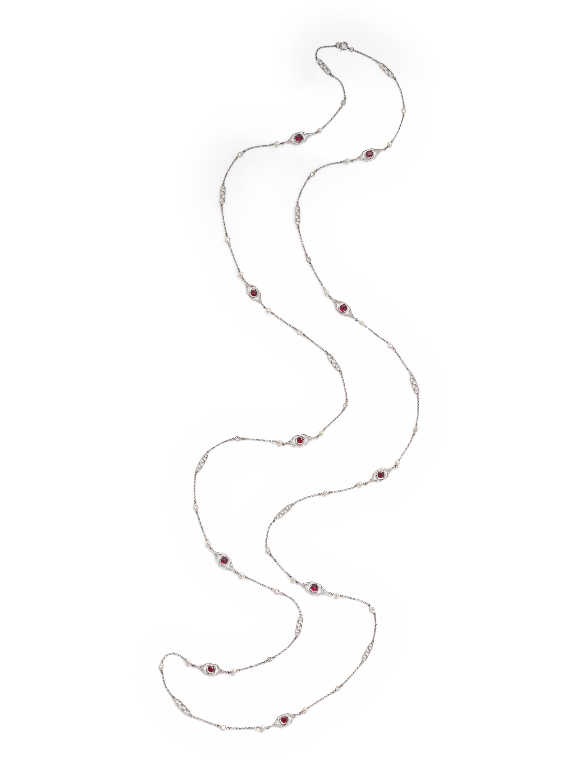 PLATINUM, DIAMOND, SEED PEARL AND SYNTHETIC RUBY LONGCHAIN NECKLACE
