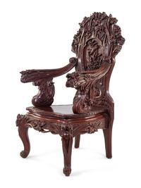 A Chinese Export Carved Hardwood Armchair