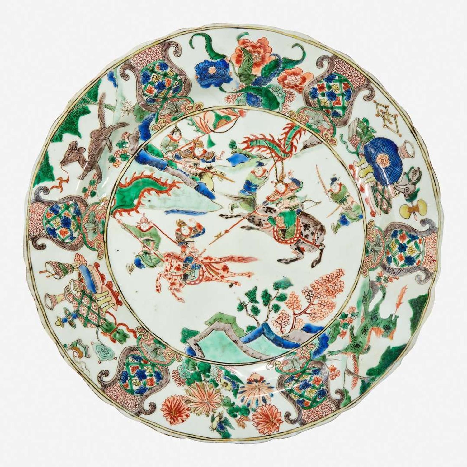 A Chinese famille verte-decorated “Mounted Warriors” charger Kangxi period