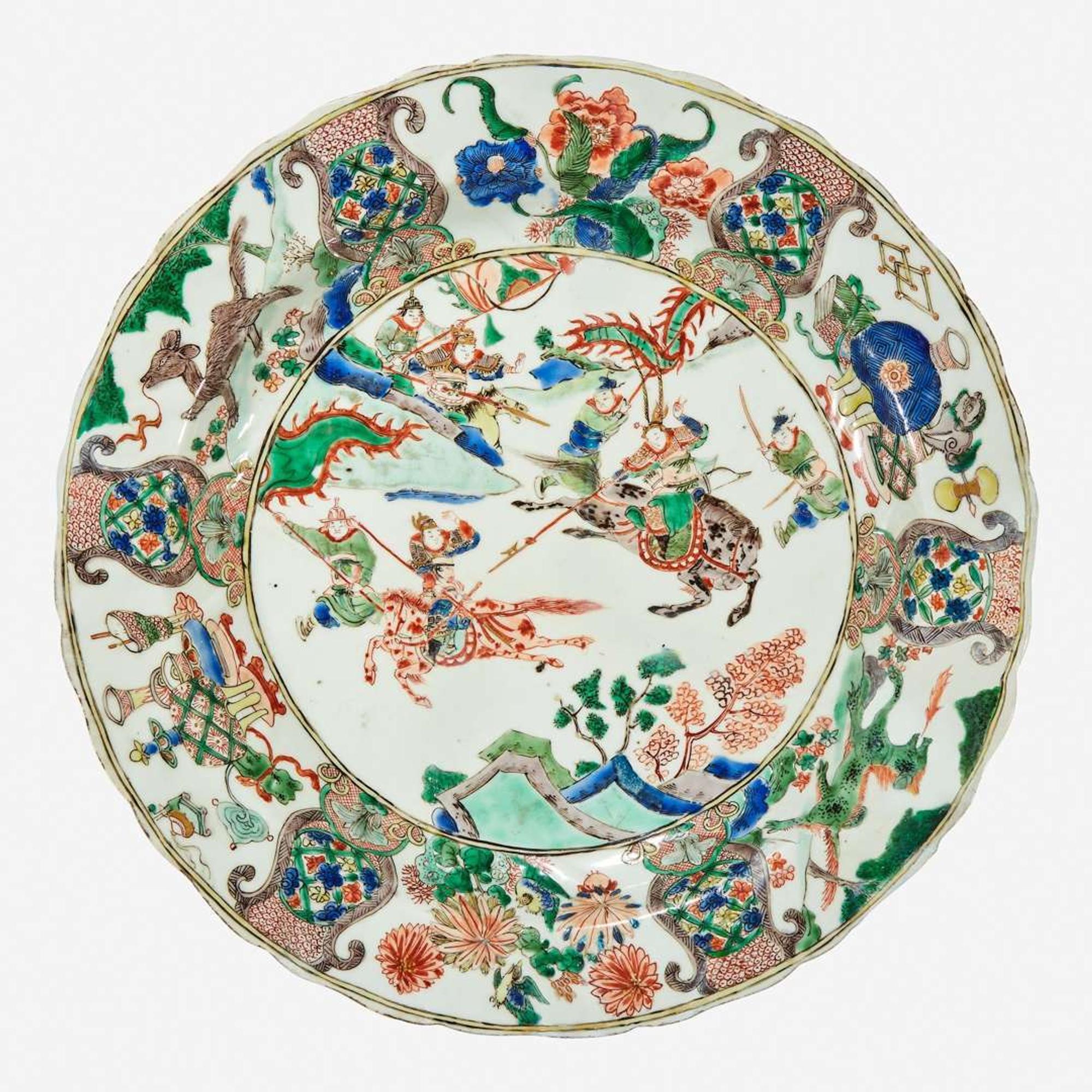 A Chinese famille verte-decorated “Mounted Warriors” charger Kangxi period