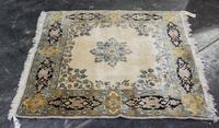 A Persian Wool Mat. 4 feet 1 inch x 4 feet 1 inch.