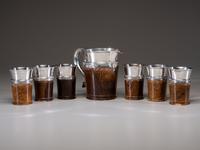 A Silver Mounted Mahogany Pitcher and Six Cups