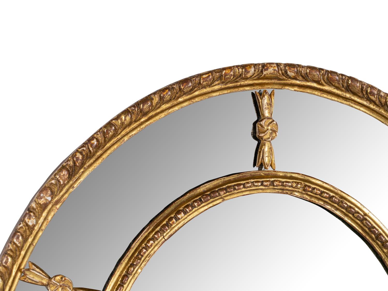 A Near Pair of George III Giltwood Oval Mirrors