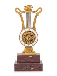 An Empire Style Gilt Bronze and Rouge Marble Clock