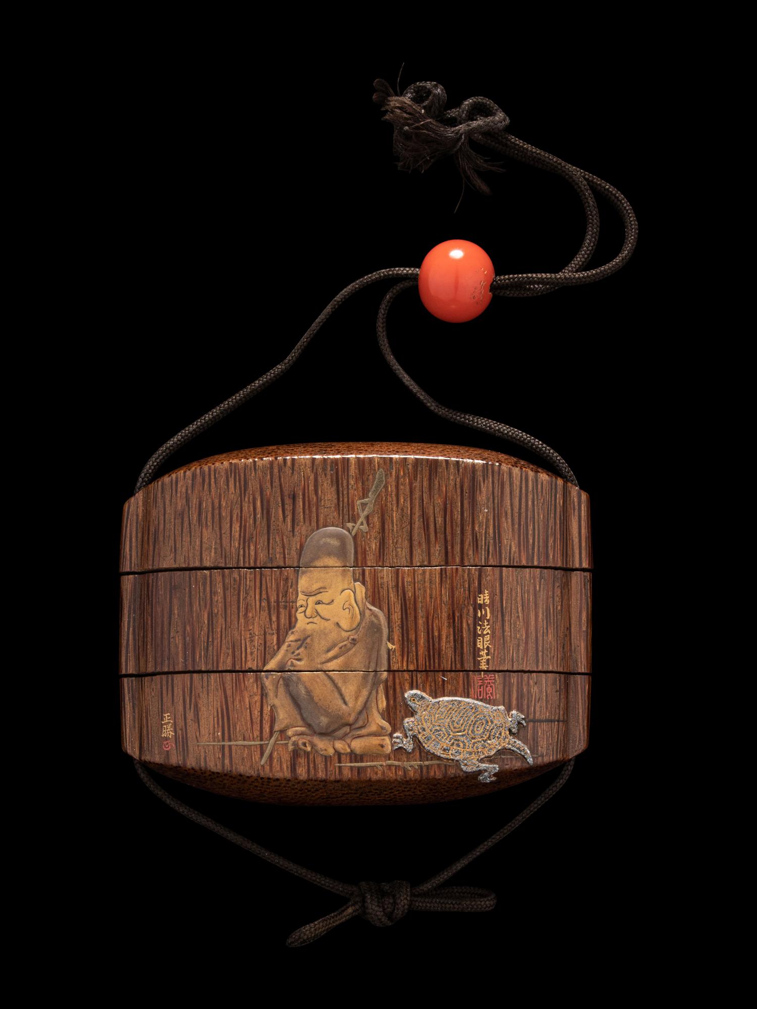 A Japanese Gold and Brown Lacquered Wood Two-Case Inro