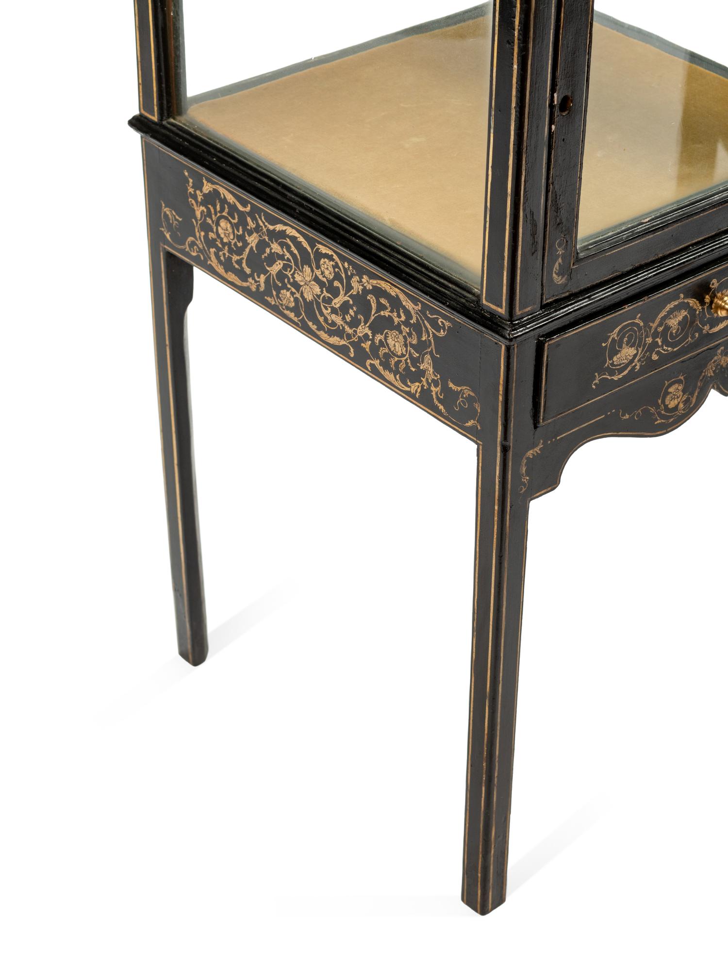 A Pair of Stenciled Black Painted Vitrine Cabinets