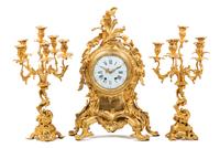 A Louis XV Style Gilt Bronze Three-Piece Clock Garniture
