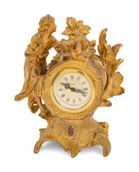 A Louis XV Style Gilt Metal Figural Clock with German Movement