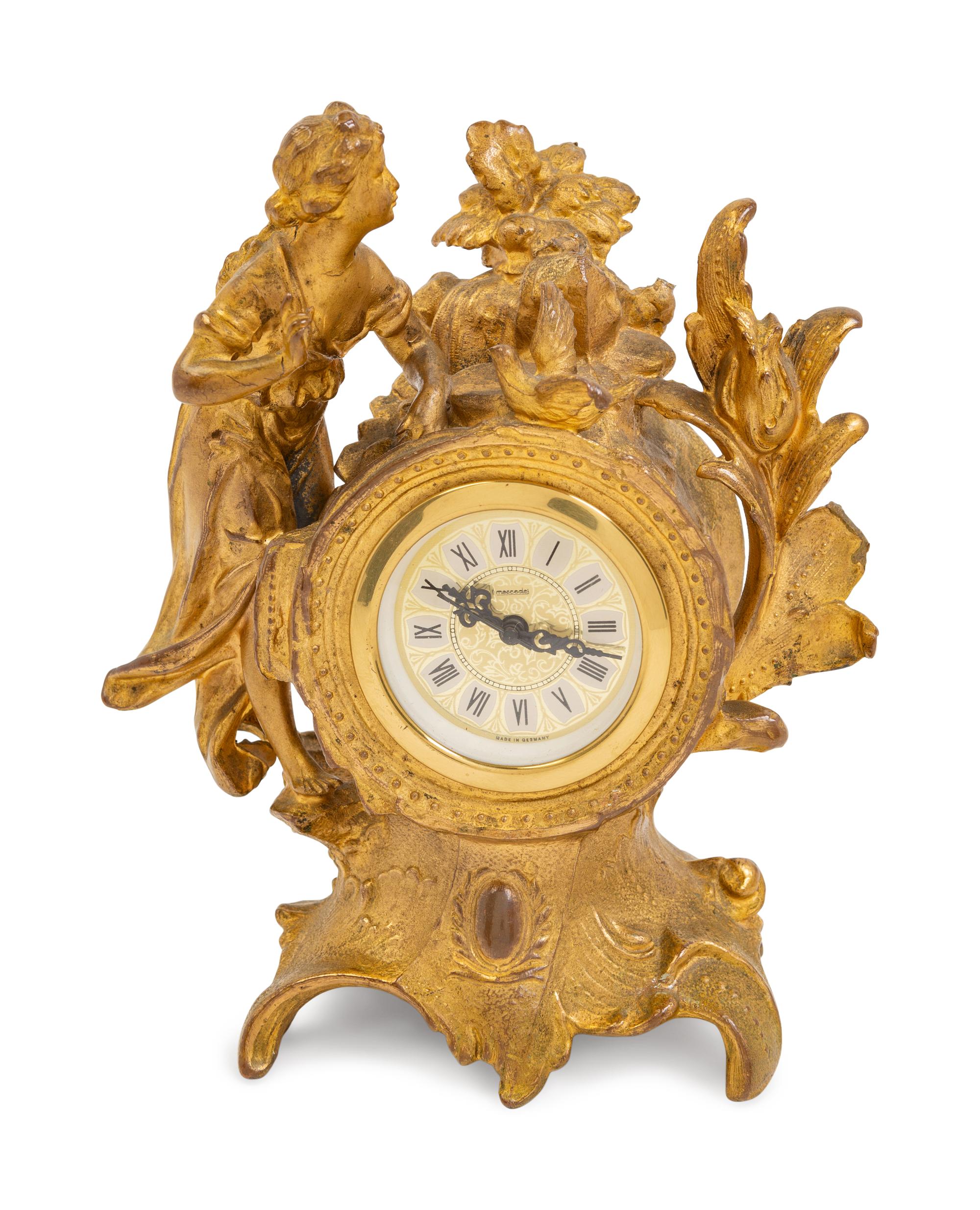 A Louis XV Style Gilt Metal Figural Clock with German Movement
