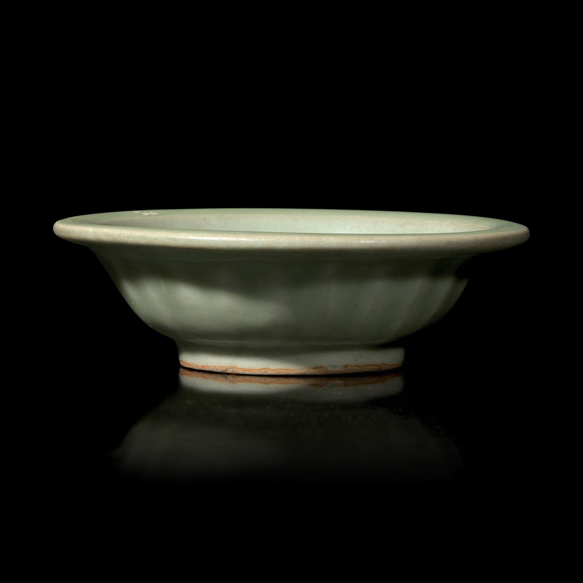 A Chinese Longquan Celadon Glazed 'Double Fish' Dish, Song-Yuan Dynasty 宋-元 龍泉窯雙魚碟