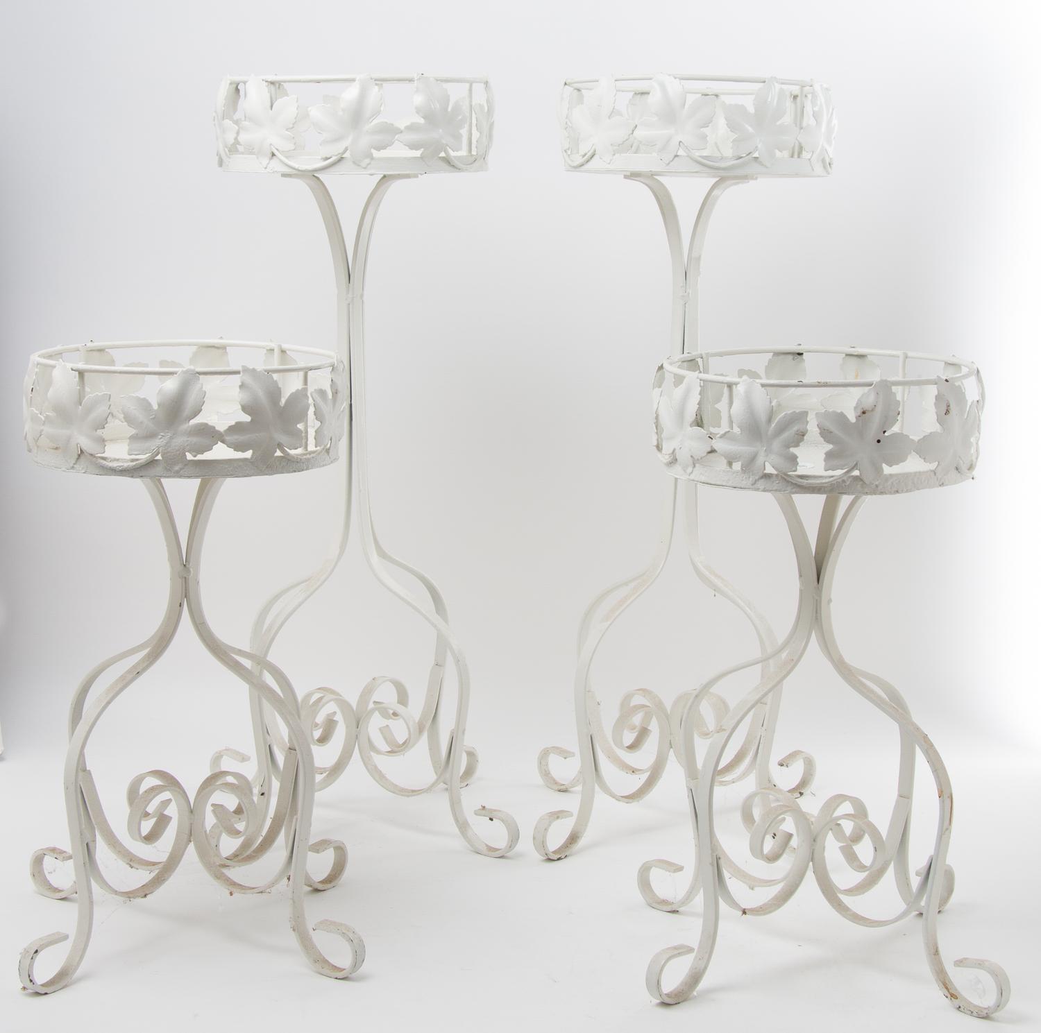 A Group of Four Painted Plant Stands Height of tallest 26 inches.