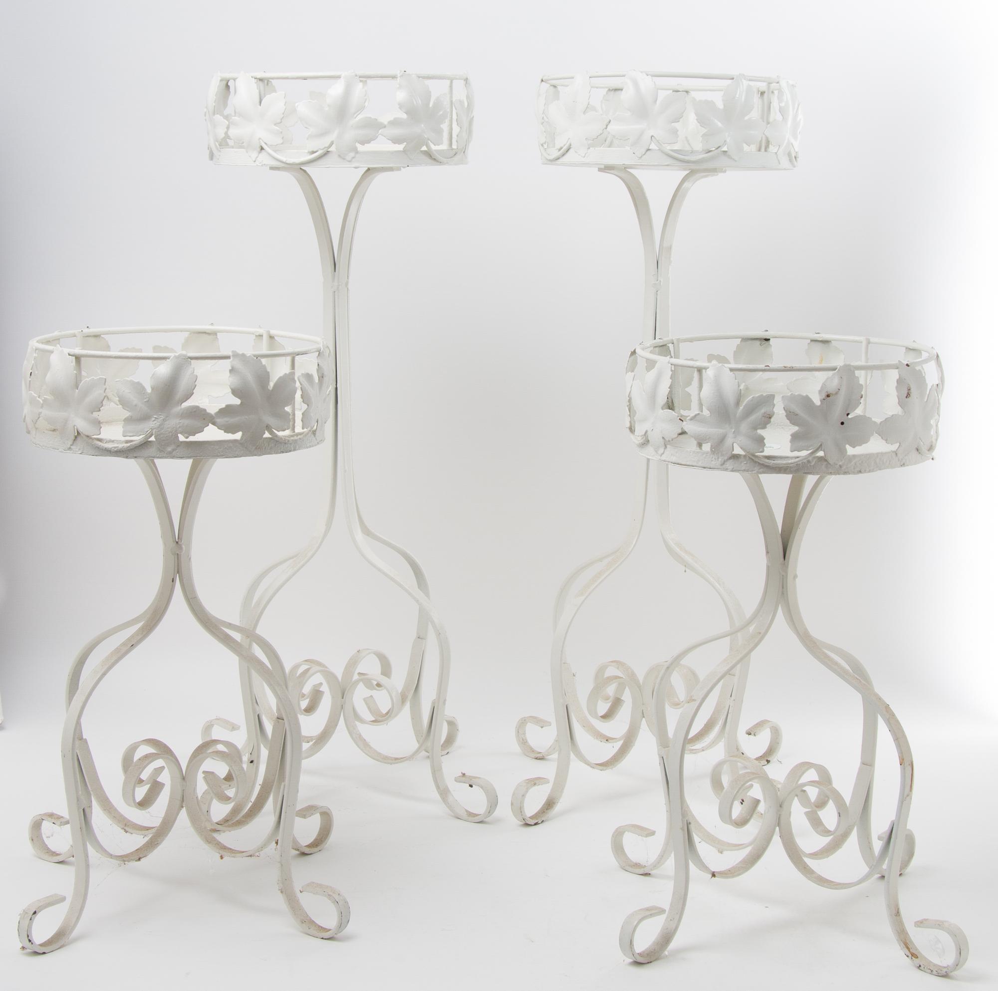 A Group of Four Painted Plant Stands Height of tallest 26 inches.
