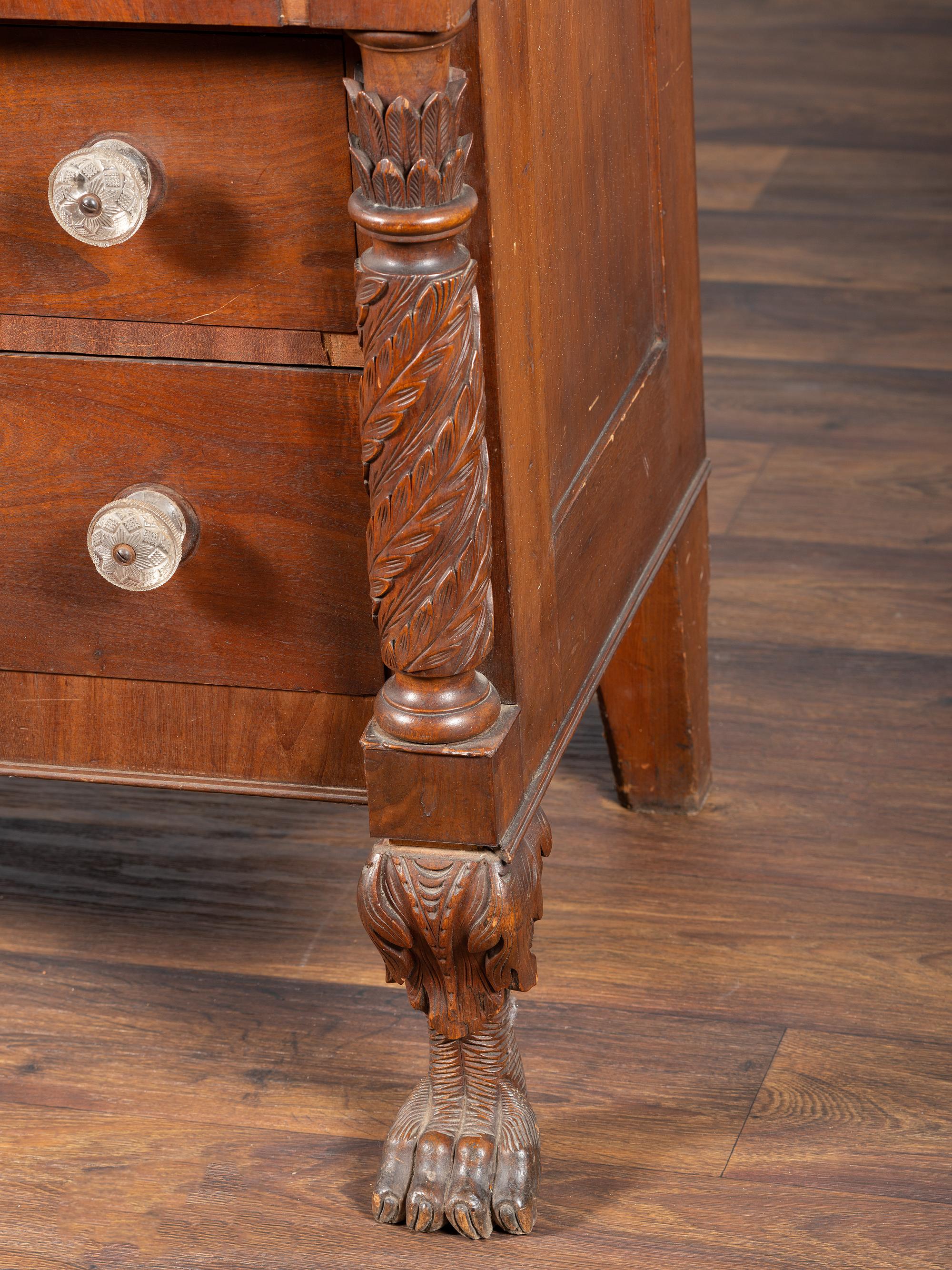 AWAITING DONATION - A Classical Carved Walnut-Veneered Chest of Drawers