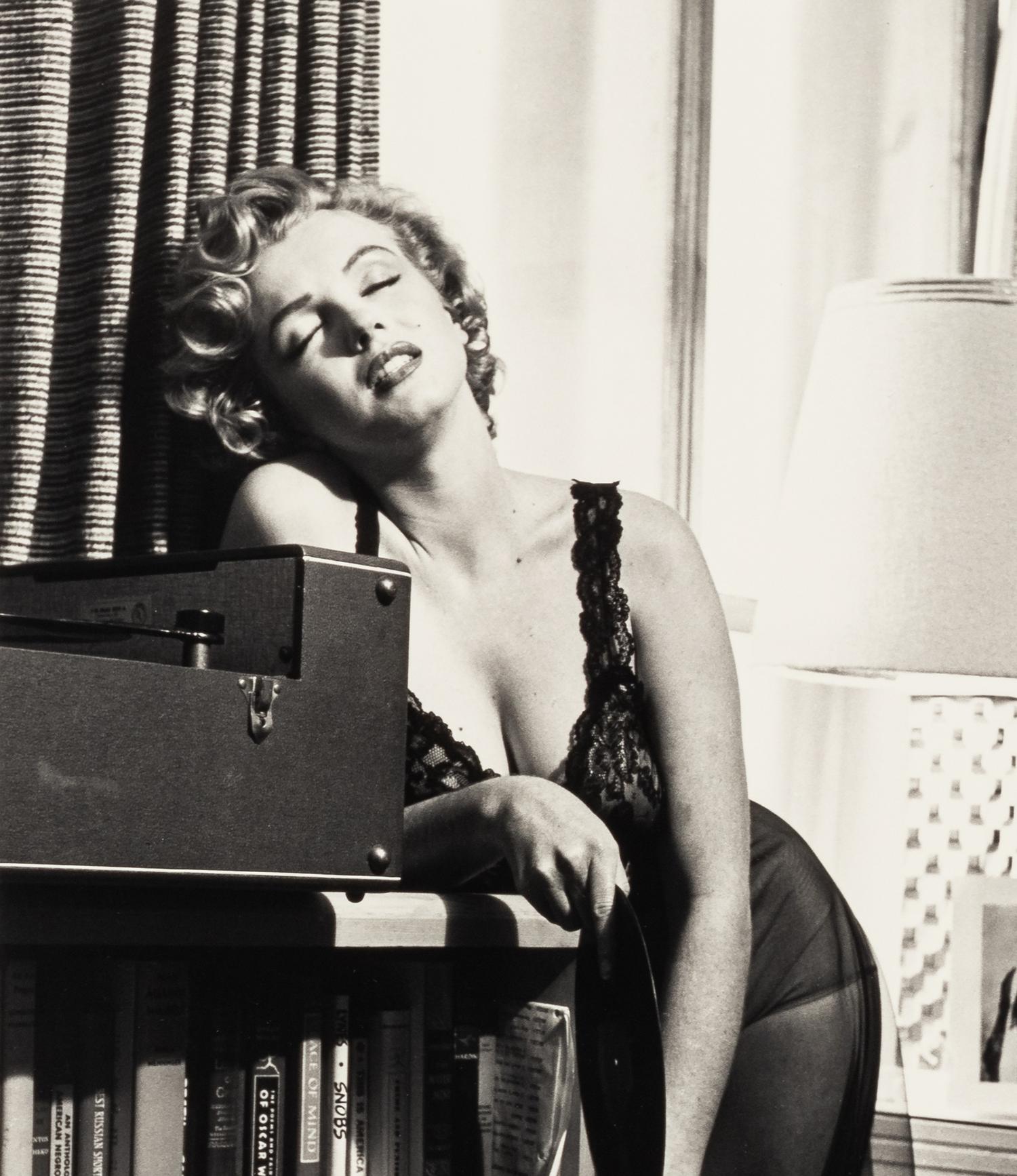 Philippe Halsman (1906-1979) Marilyn Monroe listening to music, 1952