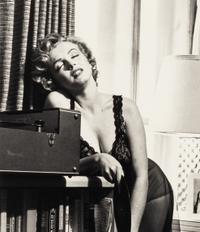 Philippe Halsman (1906-1979) Marilyn Monroe listening to music, 1952