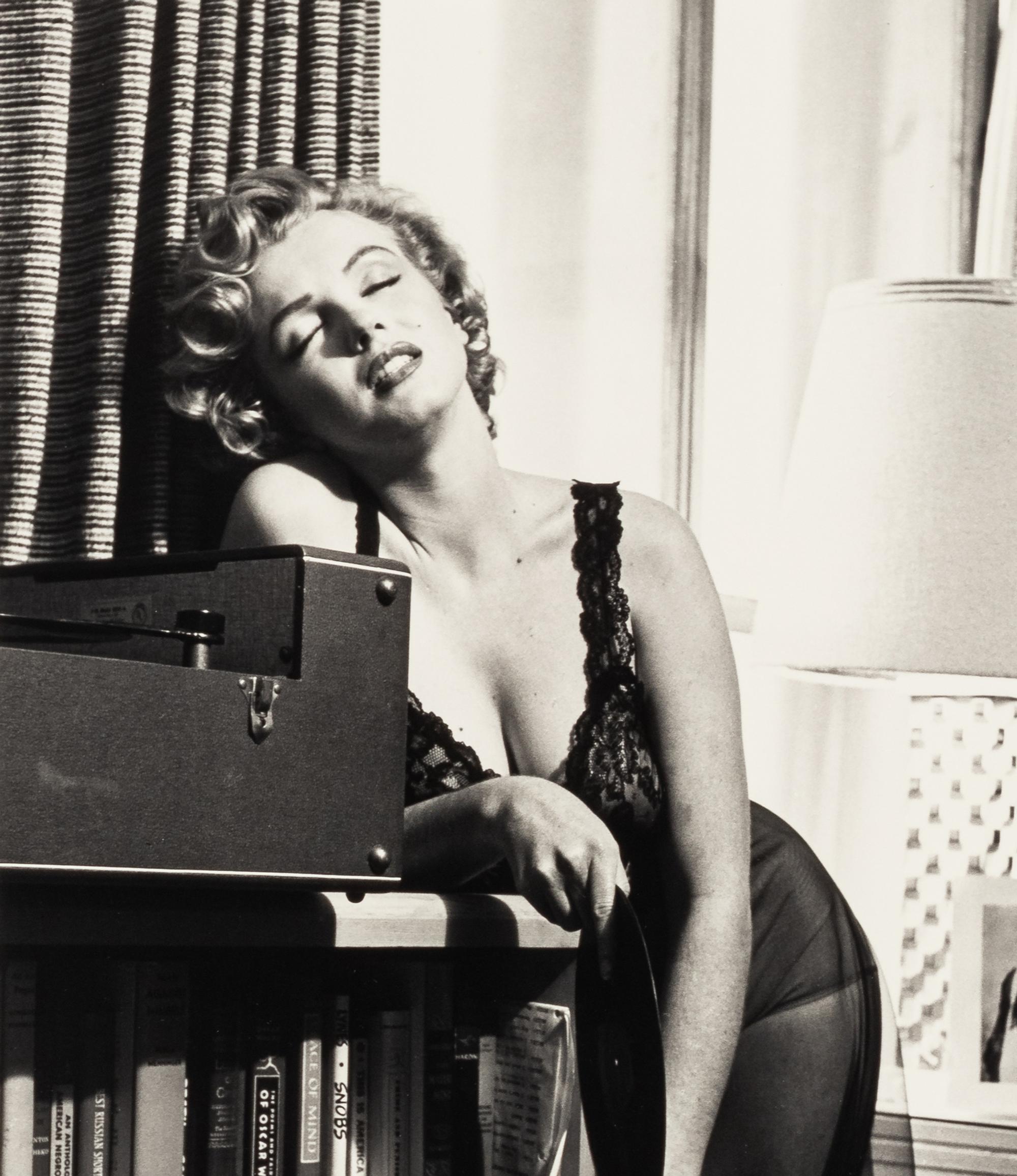 Philippe Halsman (1906-1979) Marilyn Monroe listening to music, 1952