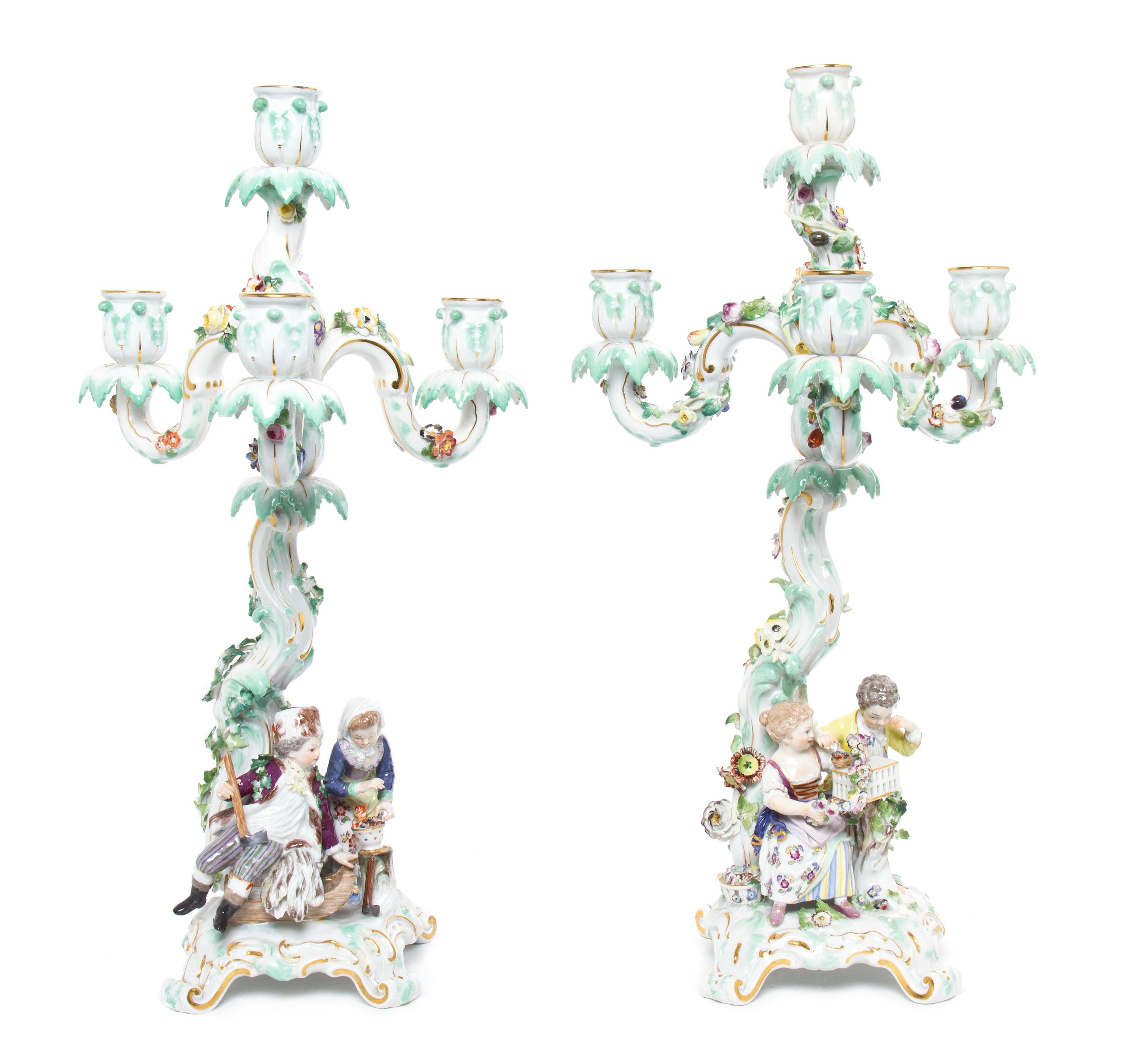 A Pair of Meissen Porcelain Four-Light Figural Candelabra, Height 17 inches.