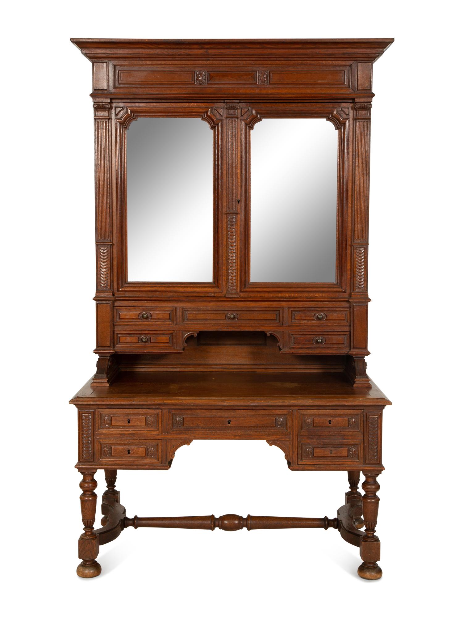 An English Carved Oak Bureau Cabinet