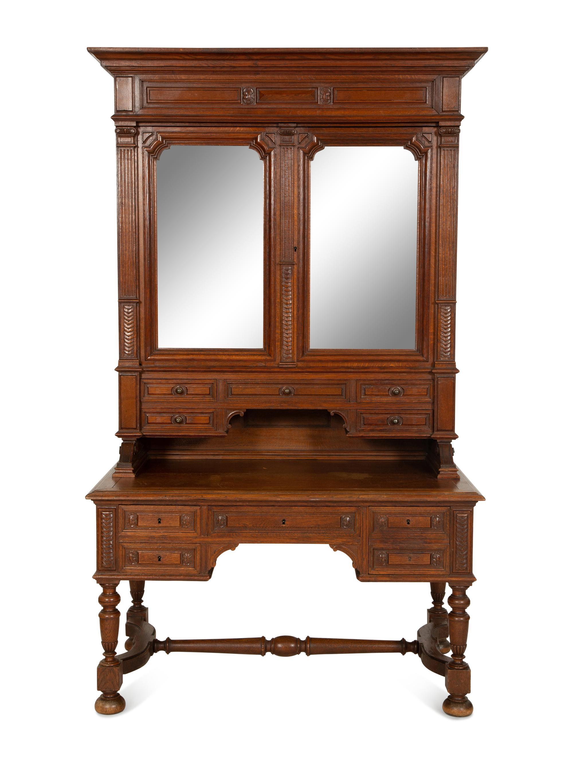 An English Carved Oak Bureau Cabinet